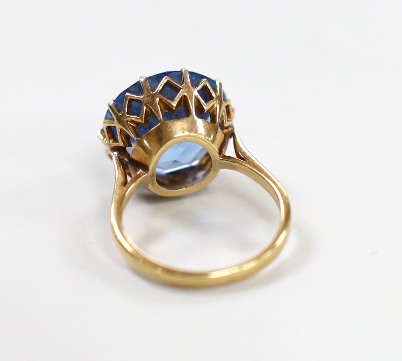 An 10k and blue paste? set ring, size K/L, gross weight 7 grams.
